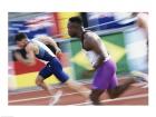 Side profile of two young men running on a running track