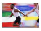 Side profile of two young men passing a relay baton