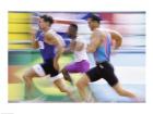 Side profile of three men running on a running track