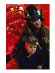 Close-up of a firefighter carrying a boy
