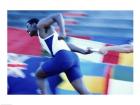 Side profile of runners passing a baton in a relay race