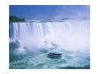 High angle view of a tourboat in front of a waterfall, Niagara Falls, Ontario, Canada