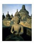 Buddha statue in front of a temple, Borobudur Temple, Java, Indonesia