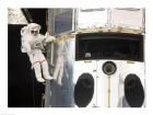 Astronaut performs work on the Hubble Space Telescope