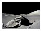 Astronaut standing near a rock on the moon, Apollo 17