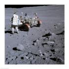 Astronaut walking near the lunar rover on the moon, Apollo 16
