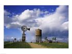 Low angle view of a water tower and an industrial windmill, 1880 Town, South Dakota, USA