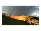 Crater of an extinct volcano with a rainbow in the sky