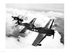 High angle view of four fighter planes flying in formation, F6F Hellcat