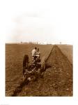 USA, Pennsylvania, Farmer on Tractor Plowing Field