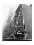 Fire engine with ladder up burning building