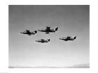 Low angle view of four fighter planes flying in formation, F9F Panther