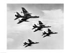 Low angle view of four fighter planes flying in formation, F-100 Super Sabre