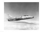 Side profile of a fighter plane in flight, F-100C Super Sabre