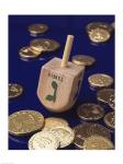 Close-up of a Hanukkah dreidel with Hanukkah gelts