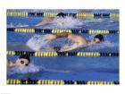 Three swimmers racing in a swimming pool