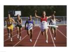 Male athletes running on a running track