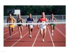 Male athletes running on a running track