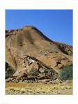 Tourists climbing on a rock, Ayers Rock, Uluru-Kata Tjuta National Park, Australia