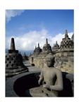 Buddha statue in front of a temple, Borobudur Temple, Java, Indonesia