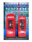 Two telephone booths near a grille, London, England