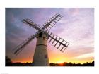 Boats moored near a traditional windmill, Horsey Windpump, Horsey, Norfolk Broads, Norfolk, England