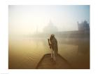 Silhouette of a man standing on a boat in the Yamuna River, Taj Mahal, Agra, Uttar Pradesh, India