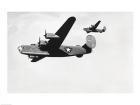 Low angle view of two bomber planes in flight, B-24 Liberator