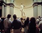 View of the David by Michelangelo and tourinsts in Galleria dell'Accademia, Florence, Italy (photo)