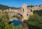 Besalu, Girona Province, Catalonia, Spain. Fortified bridge known as El Pont Vell, the Old Bridge, crossing the Fluvia river. Documents dating back to the 11th century mention a bridge on this site. (photo)
