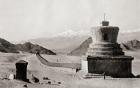 A Tibetan Mani-wall, near Leh in the Himalayas, terminated by two relic towers or chorlens. These stone structures are a compilation of intricately carved stone tablets, most with the inscription "Om Mani Padme Hum" which loosely translates to "Hail to th