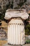 Ancient Delphi, Phocis, Greece. Broken column on the Sacred Way crowned by Corinthian capital (photo)