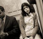 Woman sitting on a subway and staring, 2004 (b/w photo)