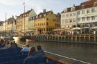Typical architecture and boats at Nyhavn canal, Copenhagen, Denmark (photo)
