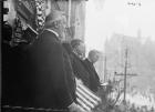 Theodore Roosevelt overlooking a street (b/w photo)