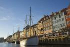 Typical architecture and boats at Nyhavn canal, Copenhagen, Denmark (photo)