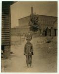 12 year old Eddie Norton, makes about 40 cents a day as a sweeper at Saxon Mill, Spartanburg, North Carolina, 1912 (b/w photo)