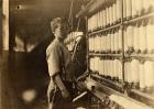 John Dempsey, 11 or 12 years old, Saturday worker in the mule-spinning room at Jackson Mill, Fiskeville, Rhode Island, 1909 (b/w photo)