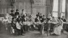 A ladies Red Cross sewing meeting in Claridge's Hotel, making woollen shirts for the war effort during World War I, from 'The Illustrated War News', 1914 (b/w photo)