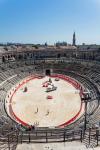 Nimes, Gard Department, Languedoc-Roussillon, France. Interior of the Roman amphitheatre. The amphitheatre is used for various events. Here it is being prepared for a bullfight.