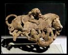 Ornamental plaque depicting a wild boar struggling with two tigers, from Tomb 3 at Shih-chai-shan, Yunnan Province, Western Han Dynasty, 2nd-1st century BC (bronze)