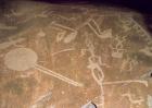 Carved petroglyph depicting figures, deer, elk, birds, boats and circles, 3rd millennium BC (granite)