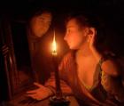 A Lady Admiring An Earring by Candlelight (oil on canvas)