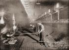 Drawing retorts by hand in the South Metropolitan Gas Company, London, England in the late 19th century. The retorts were where coal was heated to generate the gas. The crude gas was siphoned off and passed on to the condenser and the waste product left i