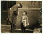 8 year old newsboy Michael McNelis, who'd just recovered from his second bout of pneumonia, selling papers in a rain storm, Philadelphia, Pennsylvania, 1910 (b/w photo)