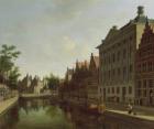 View of the Kloveniersburgwal in Amsterdam, with the Waag, and barge moored in the front of Trippenhuis to the right, 1685