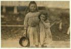 Maud and Grade Daly, 5 and 3 years old pick about a pot of shrimp each day for the Peerless Oyster Company, Bay St. Louis, Mississippi, 1911 (b/w photo)