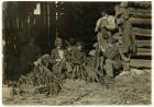 Sons of J.H. Burch aged 12, 14 & 17 stripping tobacco during school hours at Warren County, Rockfield, Kentucky, 1916 (b/w photo)