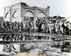 Prisoners passing the "Mihrab," the Khalifa's Prayer House, 1898 (b/w photo)