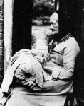 A lace maker outside her cottage in South Buckinghamshire, late C19th (b/w photo)